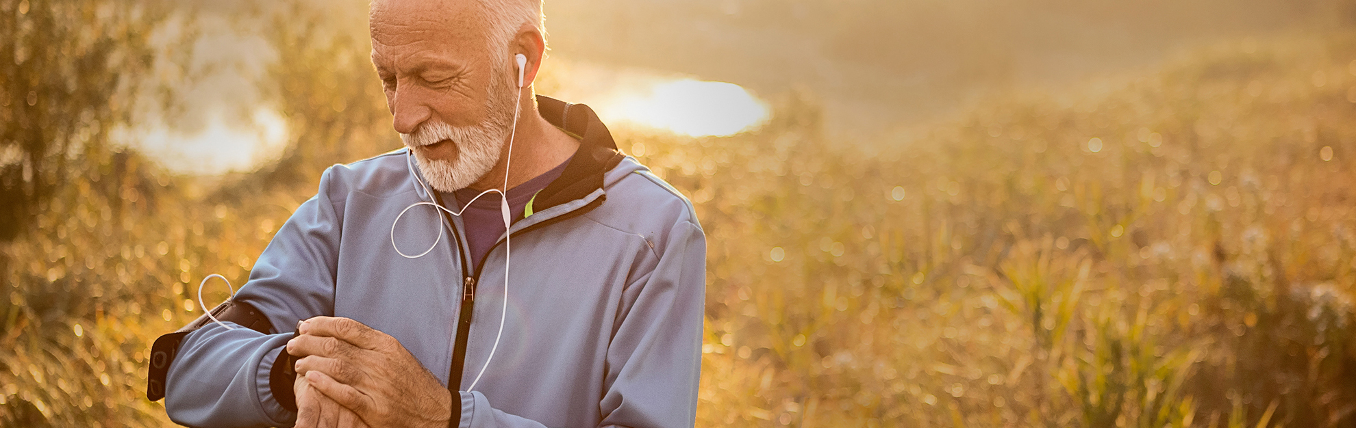 Man looking at watch while running