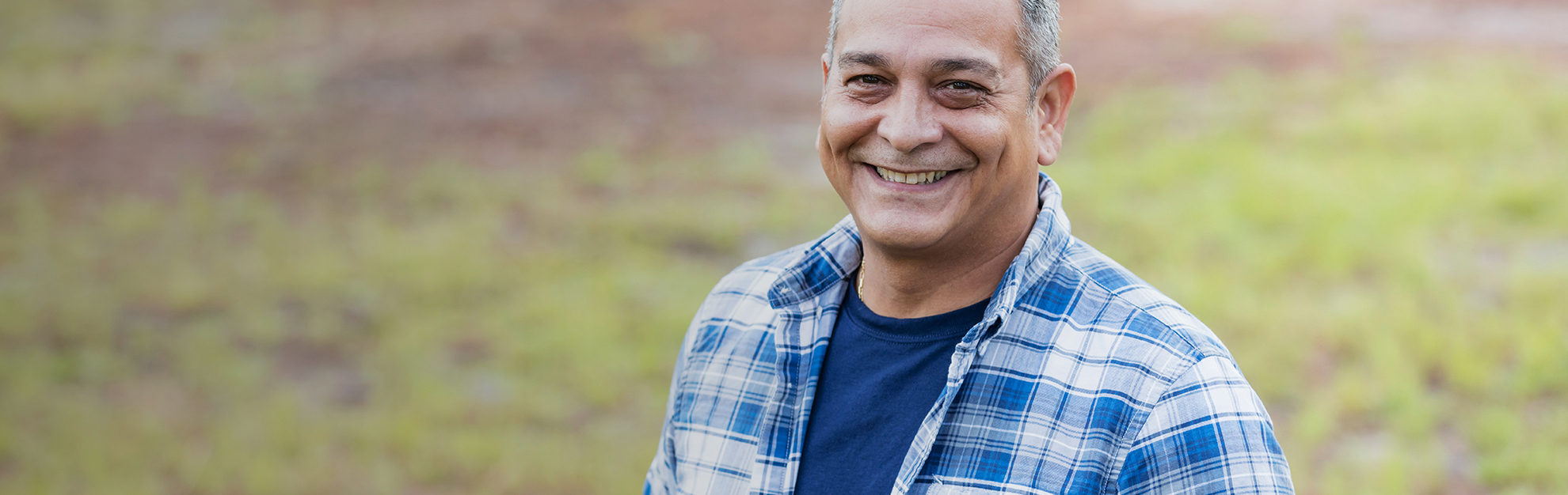 Man smiling in field